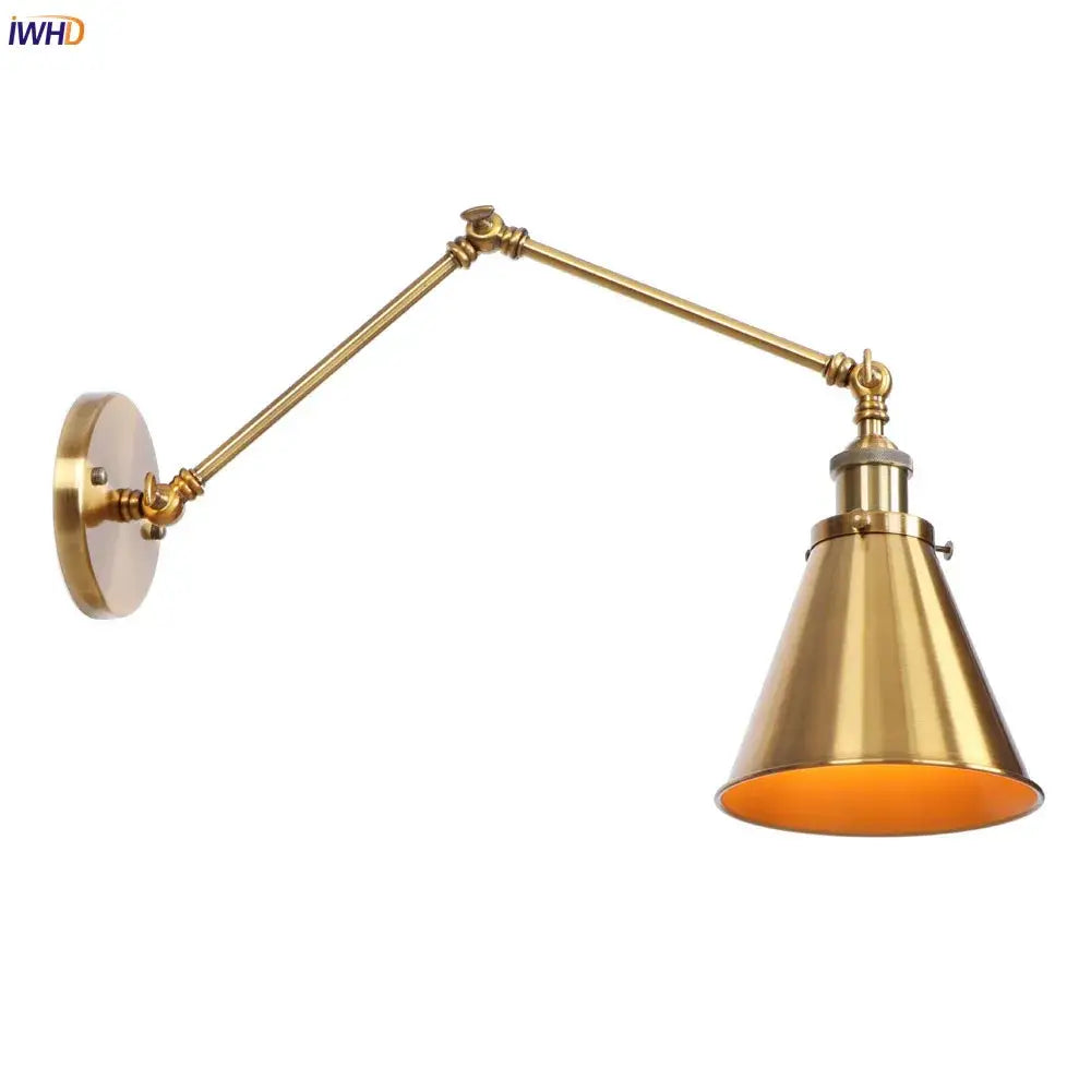 Brass-finished vintage gold swing arm wall lamp with adjustable conical shade and warm interior lining for bedroom use