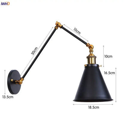 Black matte swing arm wall lamp with brass accents and adjustable arms for vintage industrial bedroom lighting