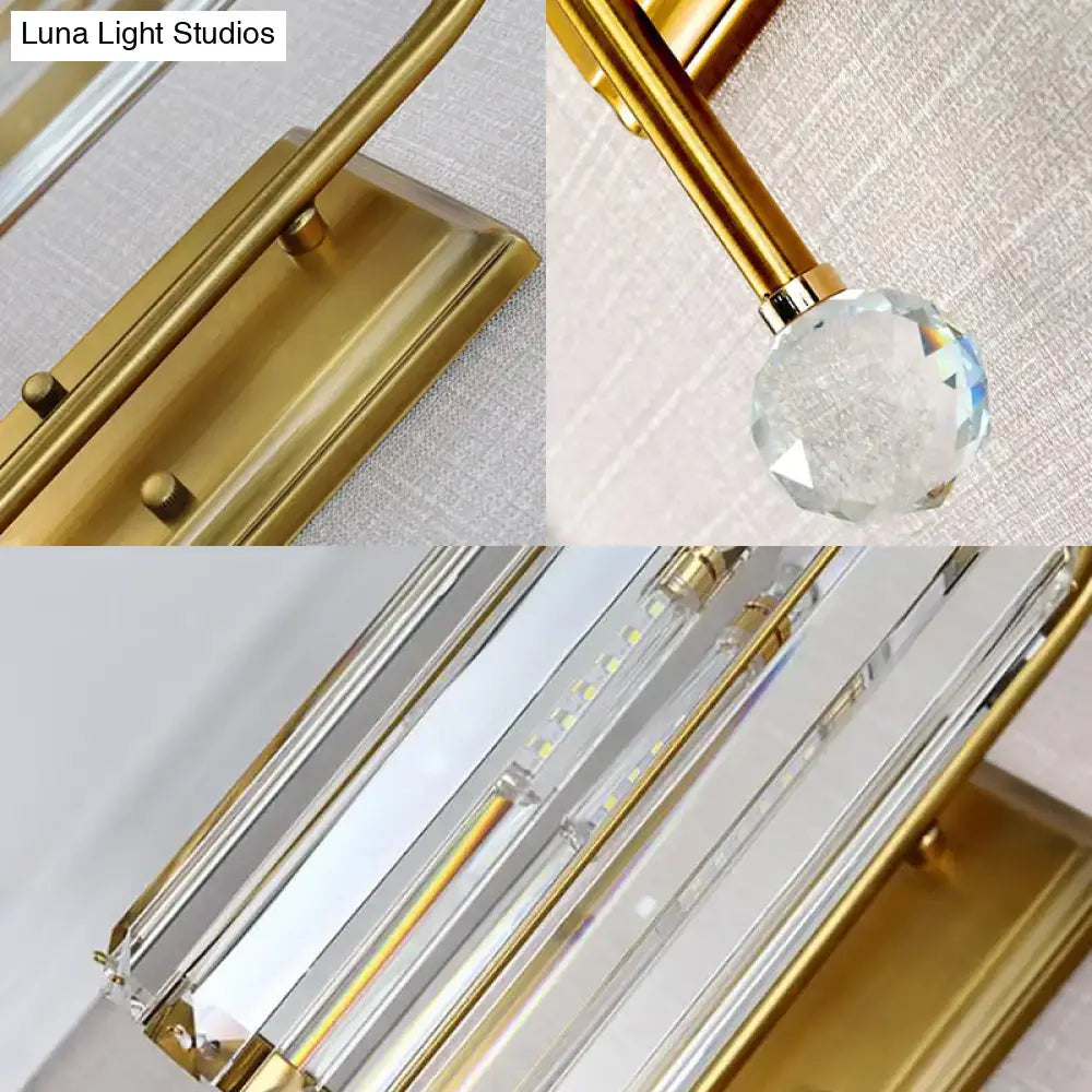 Vintage gold wall light with clear crystal shade featuring gold finish and sleek modern design for bedroom sconce