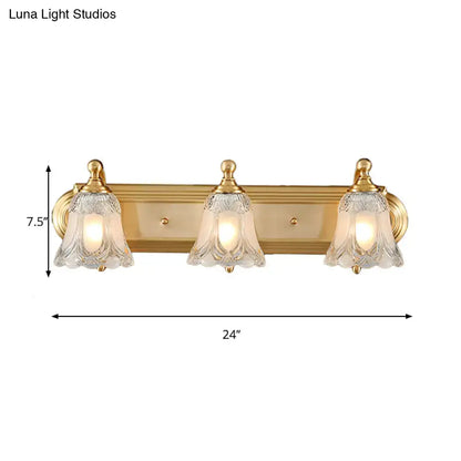 Vintage gold wall light bathroom vanity fixture with clear glass shade and gold-toned bell-shaped shades