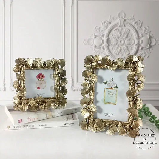 Vintage golden ginkgo leaf photo frame with metallic finish and ornate detailing for living room decor by decorbites