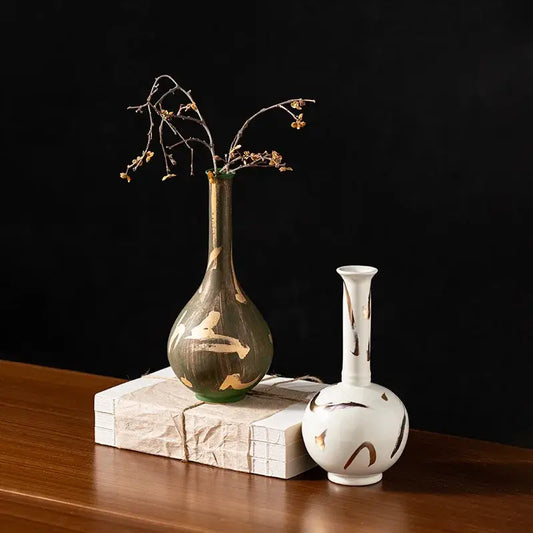 Slender vintage green and gold handmade porcelain vase with bulbous base holding dried branches for living room decorbites handmade porcelain