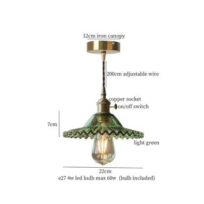 A vintage green brass glass led pendant light with scalloped glass shade and brass canopy for kitchen use