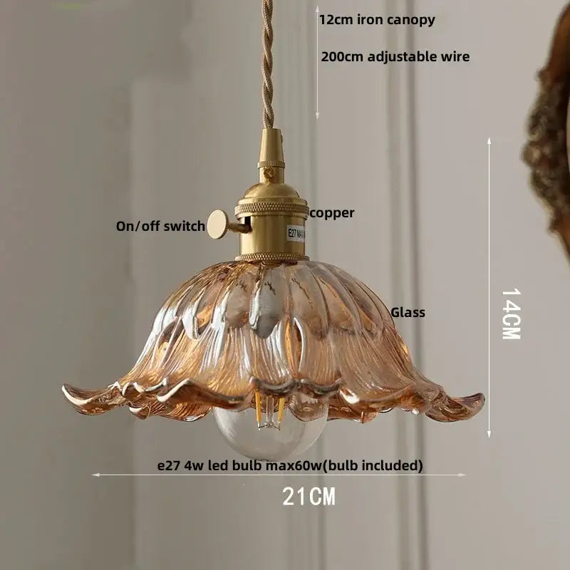 A delicate amber glass pendant light with fluted petal design and brass fixture for vintage green led pendant decor