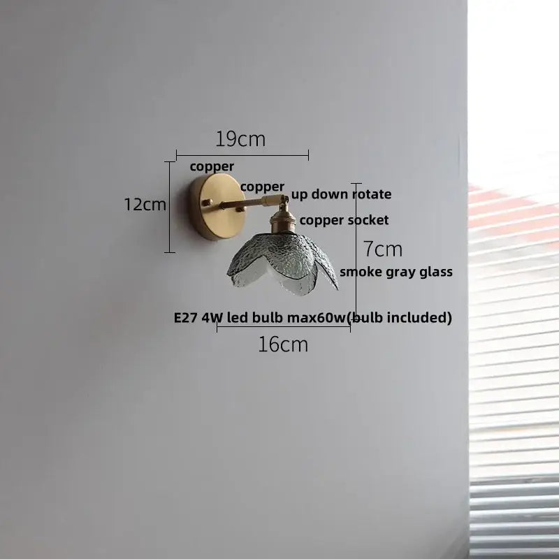 A copper vintage wall sconce with a smoke gray glass shade for bedroom or stair lighting with green glass led