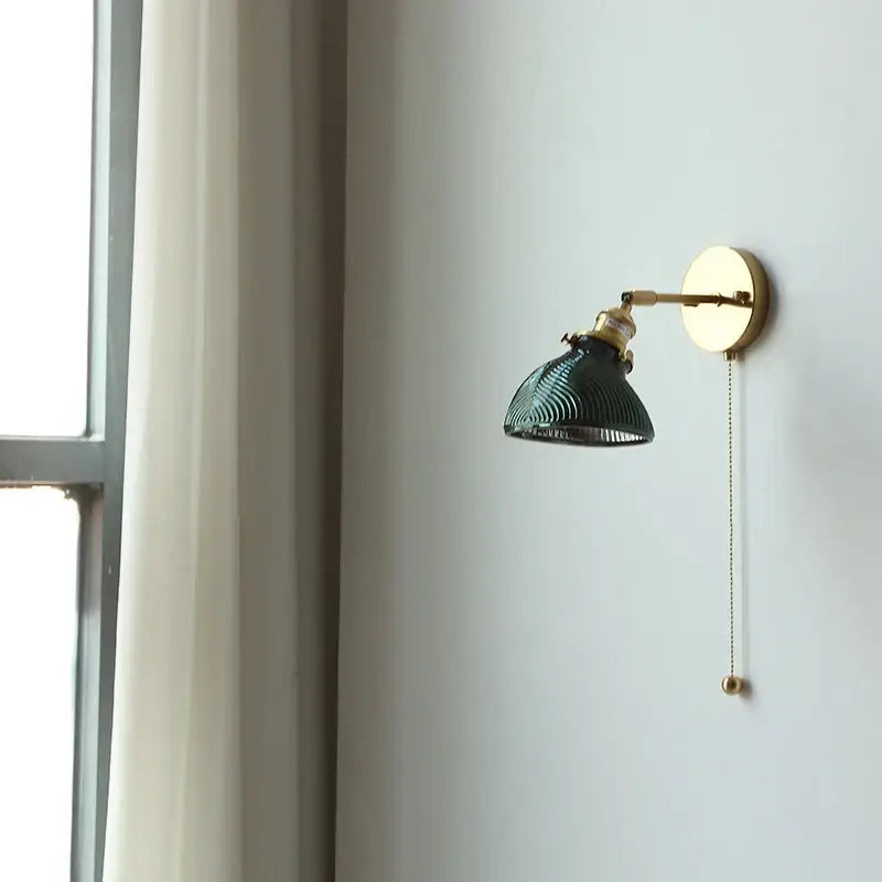 Vintage green glass led wall sconce with ribbed shade and brass finish ideal for bedroom or stair lighting