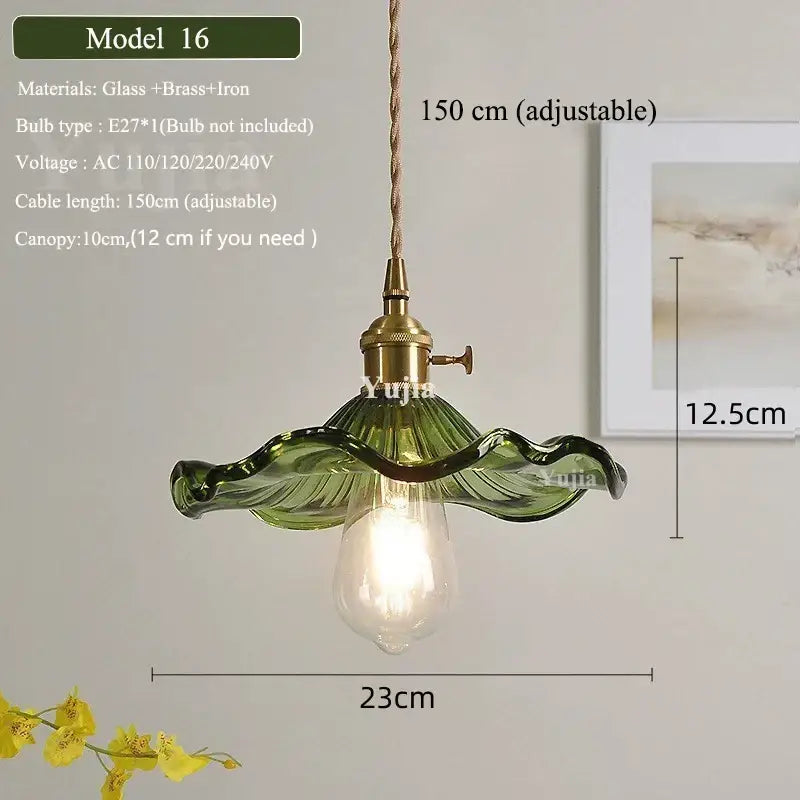Vintage green glass pendant light with ruffled petal design, brass fixture, and adjustable cord for dining room use