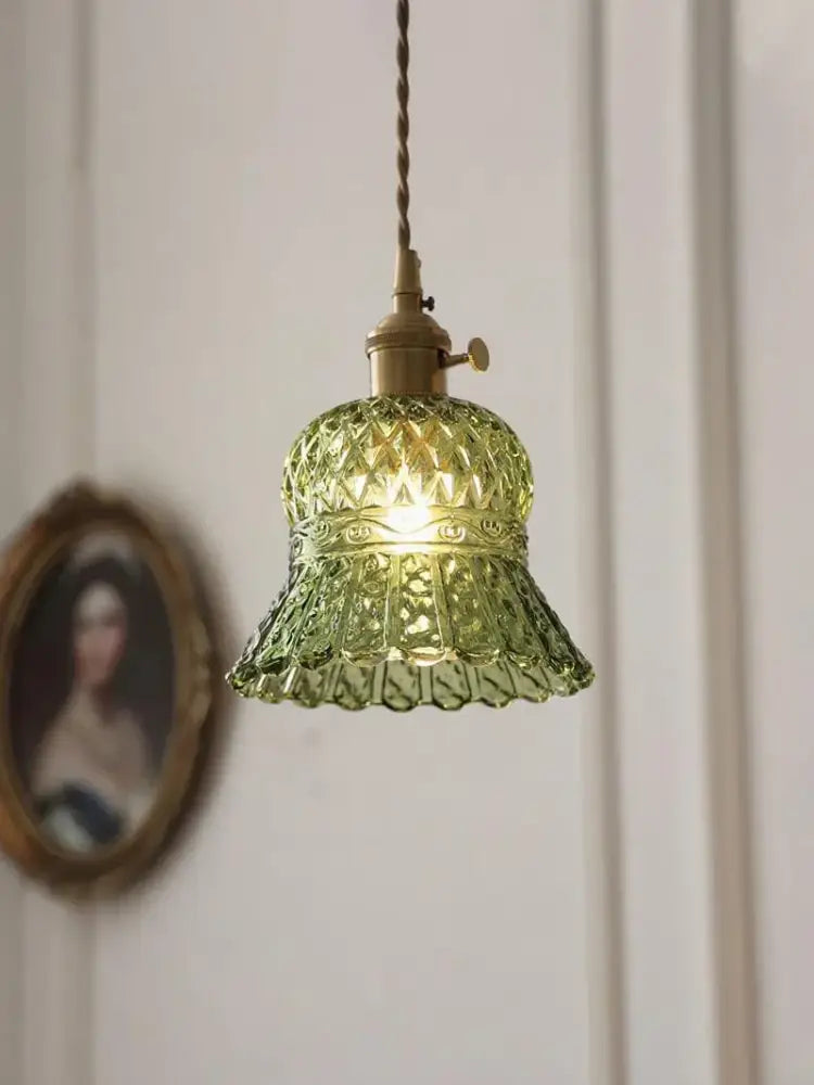 Vintage green glass pendant light with faceted shade and brass hardware for dining room lighting