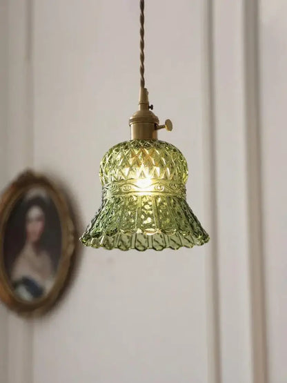 Vintage green glass pendant light with faceted shade and brass hardware for dining room lighting