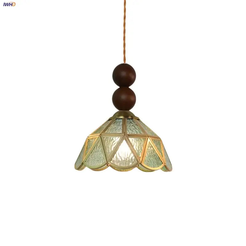 Vintage green glass pendant light with textured shade and wood beads for dining room decor featuring brass frame