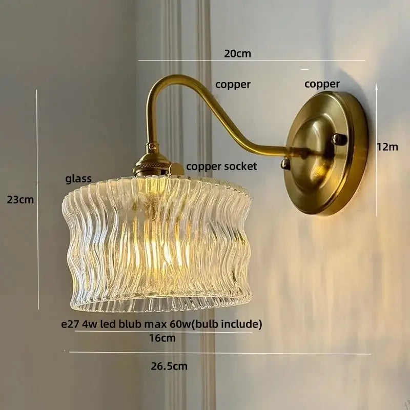 Antique brass copper wall light with clear wavy glass shade and copper knob switch featuring vintage green glass design