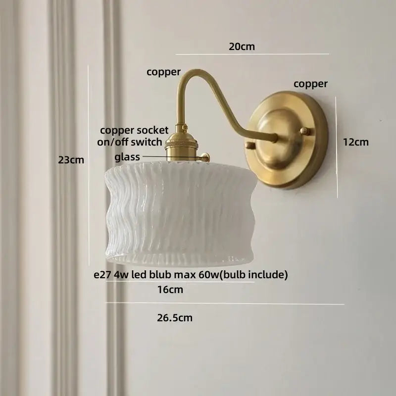 Vintage green glass wall light with antique brass-finished copper knob switch and textured white glass shade
