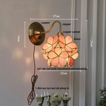 Vintage green glass wall light with copper-finished wall sconce and copper knob switch featuring pink flower panels