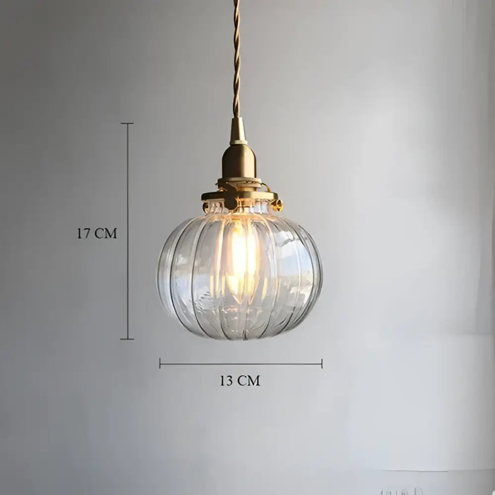 Clear ribbed glass pendant light with decorbites brass pumpkin led fixture and twisted cord for vintage bedroom decor
