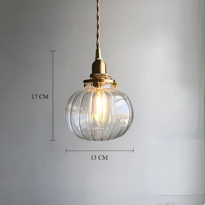 Clear ribbed glass pendant light with decorbites brass pumpkin led fixture and twisted cord for vintage bedroom decor