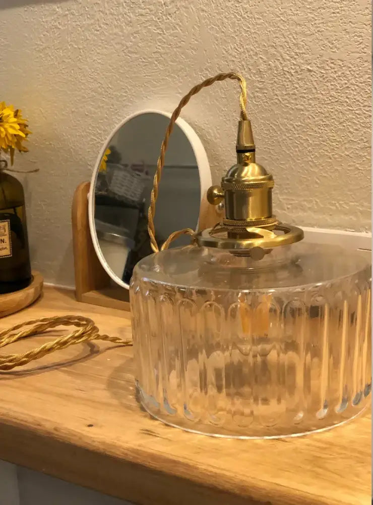 Clear glass pendant light with vertical ridges and brass pumpkin led fixture from decorbites for bedroom decor
