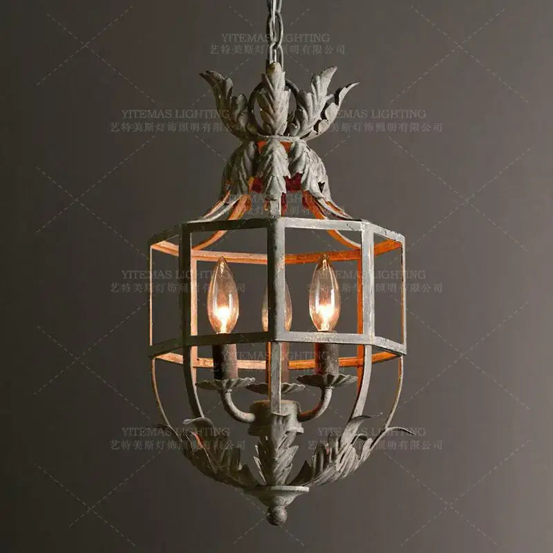 Vintage grey metal cage lantern chandelier with ornate leaf motifs and three glowing candle bulbs for dining room decorbites grey metal