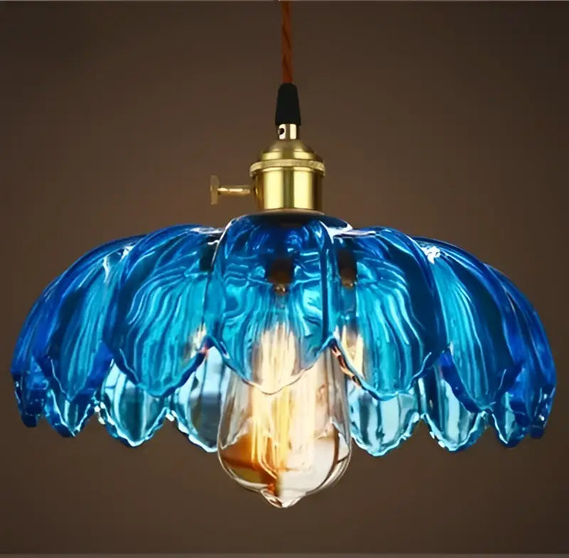Vintage hand blown blue glass pendant lights with brass fixture and exposed bulb ideal for vintage led cafe use
