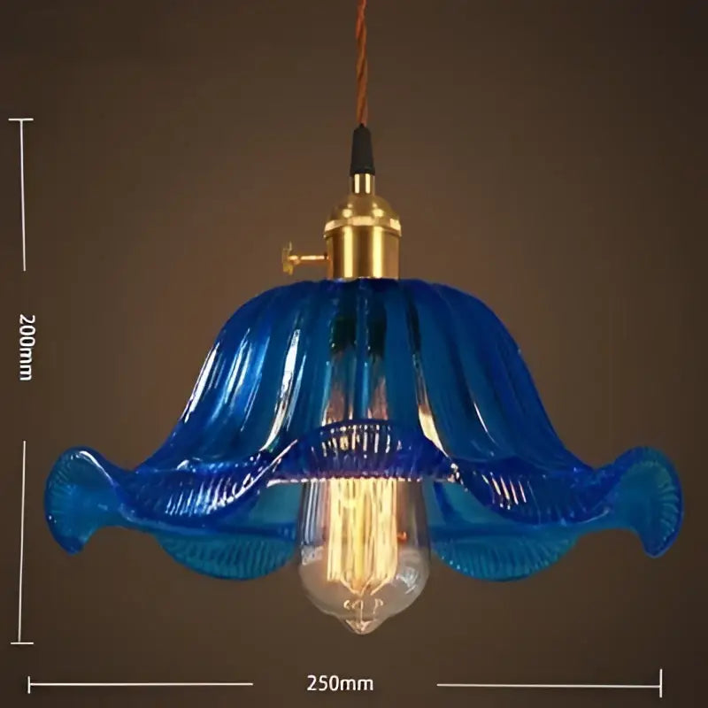 Blue glass pendant light with gold-toned metal fixture and vintage led cafe exposed filament bulb for restaurants