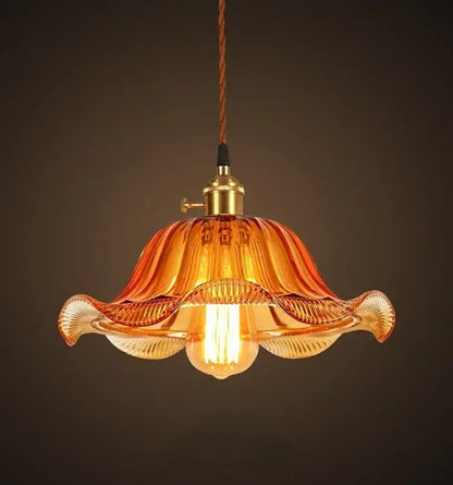 Vintage hand blown amber glass pendant lights with fluted design and brass hardware for restaurant and cafe use