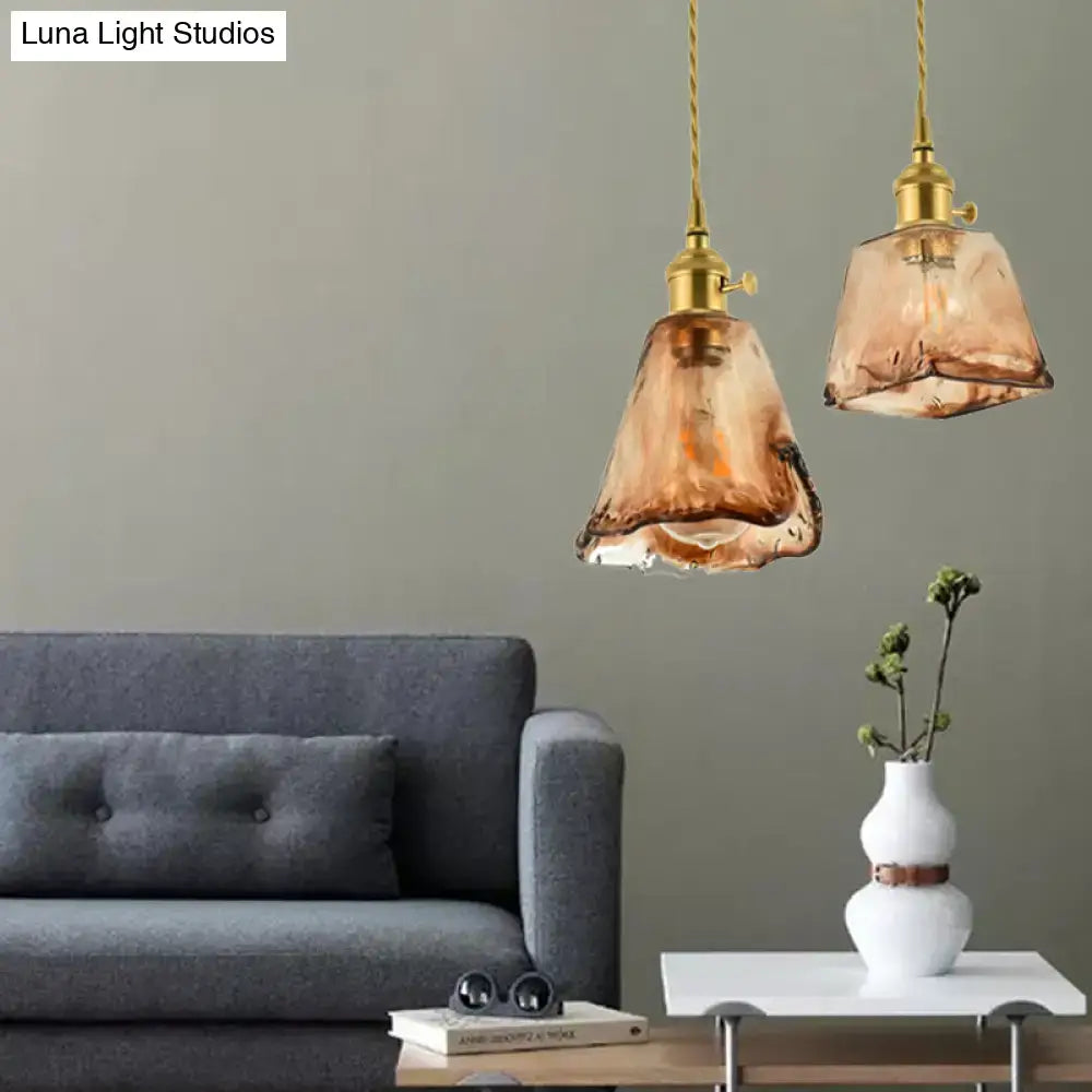 Two aubrey vintage handmade brass shaded tan glass pendant lights with twisted gold cords for indoor lighting