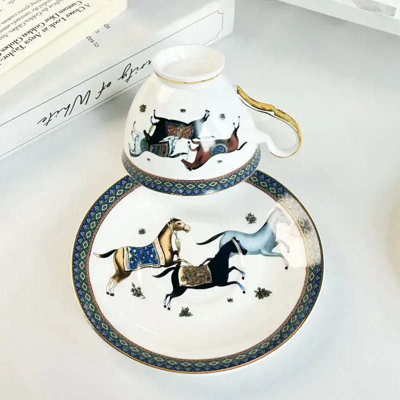Vintage white porcelain mug cup saucer with gold trim and blue horse illustration for dining room use