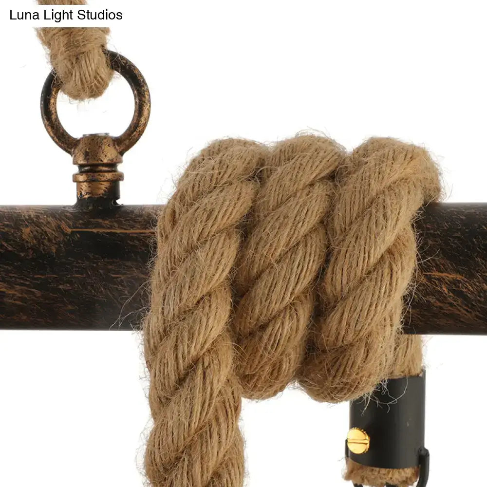 Natural fiber rope with twisted texture secured by dark metal hardware in beige metal decorbites vintage style island lighting hanging light