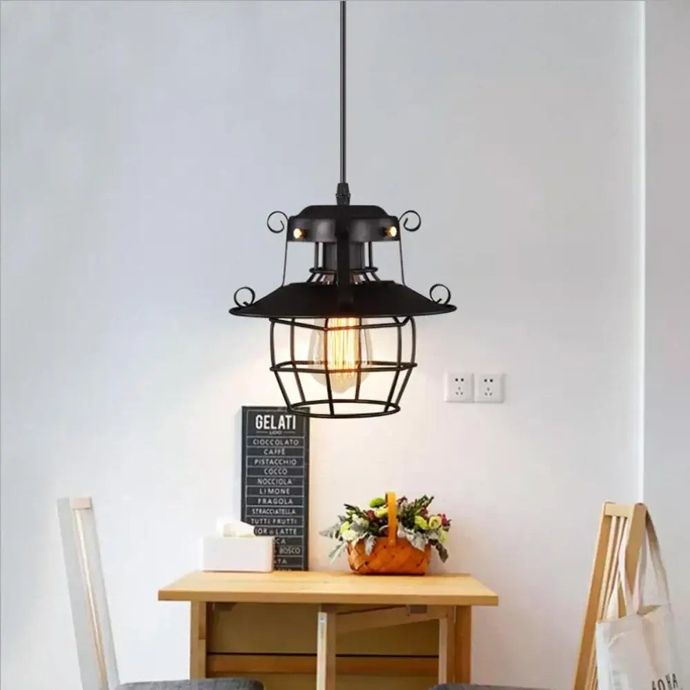 Vintage industrial black metal cage pendant light with exposed filament bulb for kitchen decorbites black metal lighting