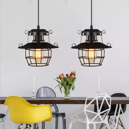Vintage industrial black metal pendant light with cage design and exposed filament bulbs for kitchen use