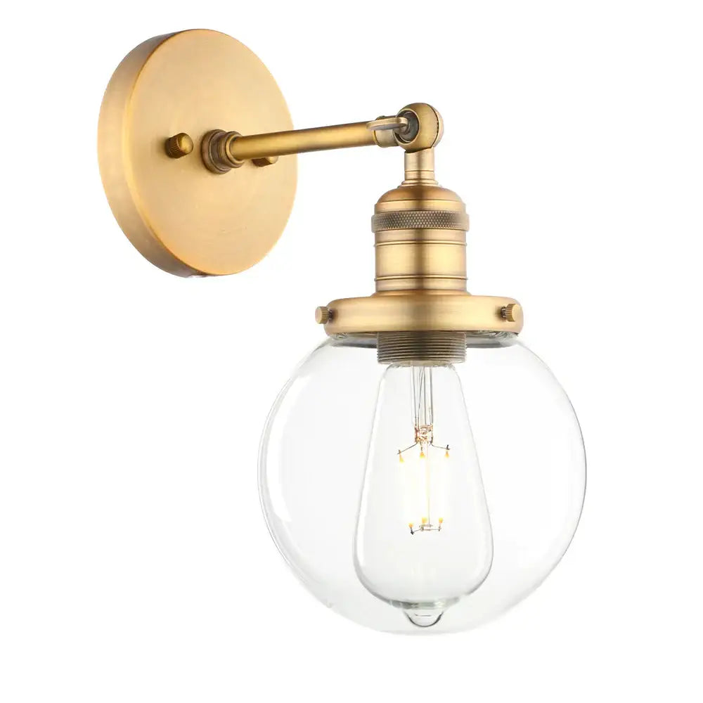 Brass-finished vintage industrial wall sconce with clear glass globe and exposed filament bulb for bedroom decorbites vintage industrial style