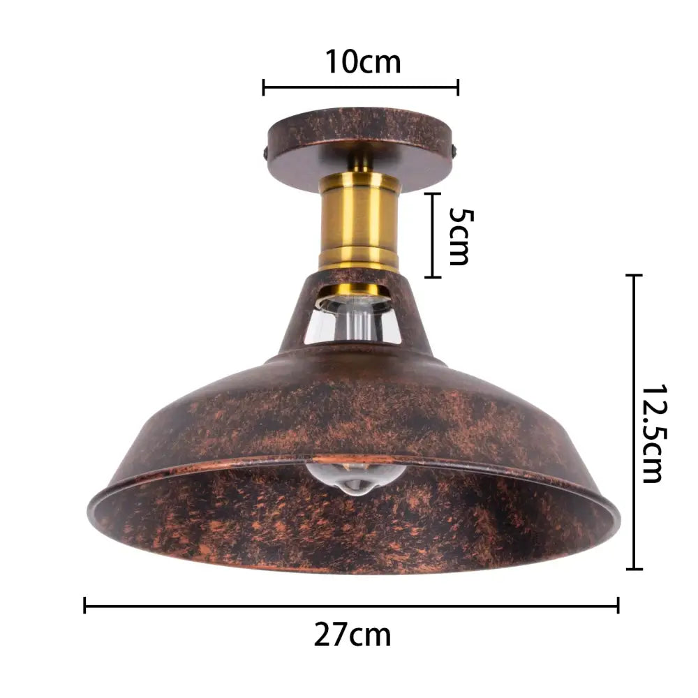 Rustic copper-toned industrial flush mount light with brass stem and visible bulb for kitchen decorbites industrial flush