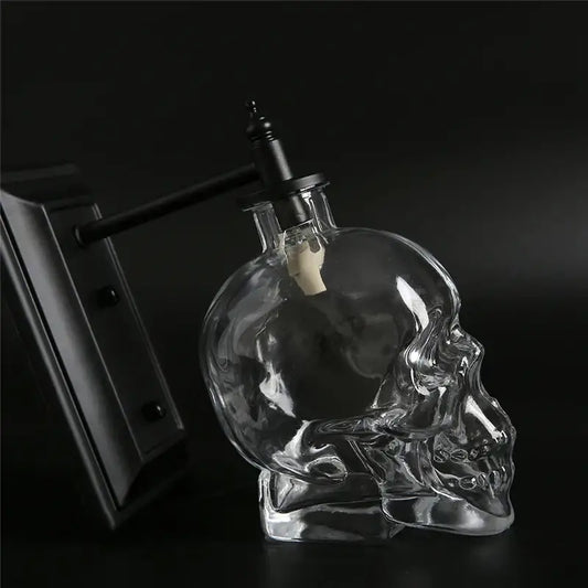 Vintage industrial clear glass skull wall sconce with black metal spout and cork stopper for living room lamp