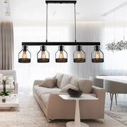 Black DecorBites™ vintage industrial island light with five filament bulbs and wire guard metal cages