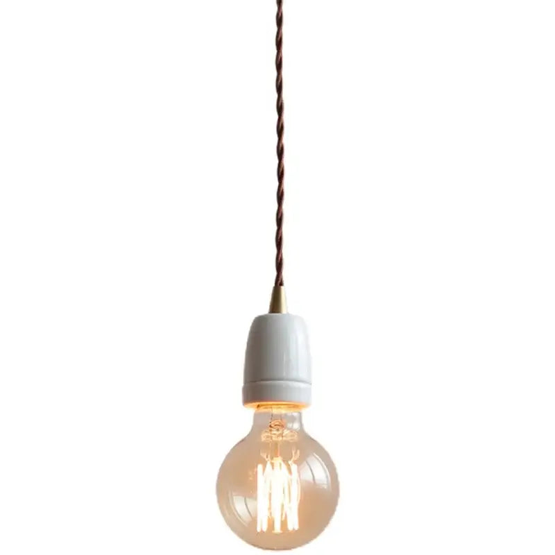 Vintage industrial matte white ceramic led pendant lamp featuring a warm-toned edison bulb with twisted brown cord
