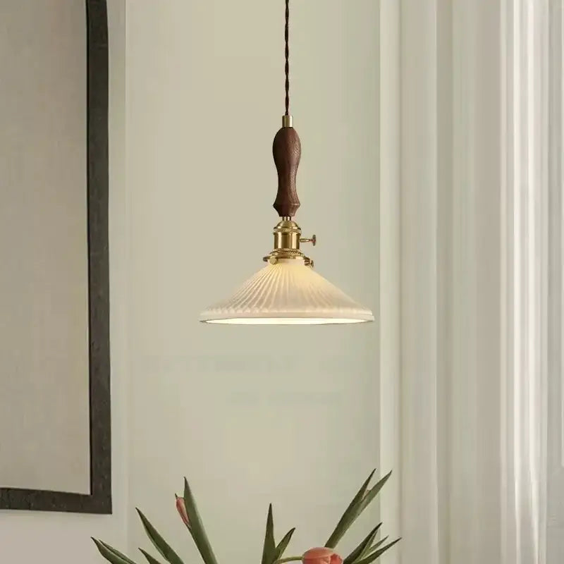 Vintage Japanese ceramic led pendant lamp with dark wood handle brass hardware and off-white ribbed glass shade decorbites ceramic led