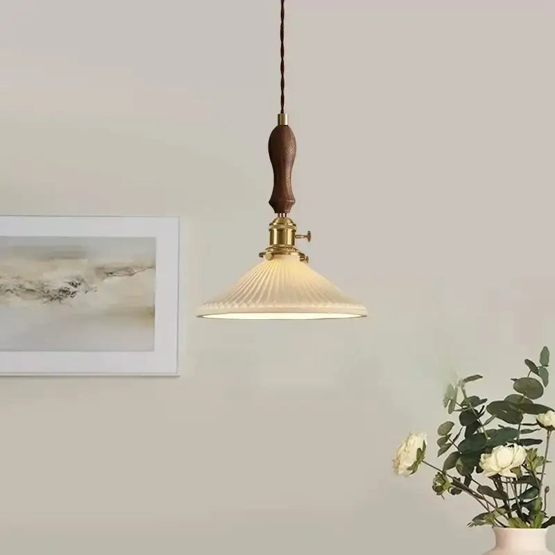 Vintage Japanese ceramic LED pendant lamp with a ribbed off-white glass shade wooden handle and brass hardware