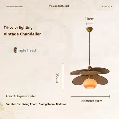 Vintage layered wood petal pendant light with dark bronze shades and amber glass globe for dining room brass accent