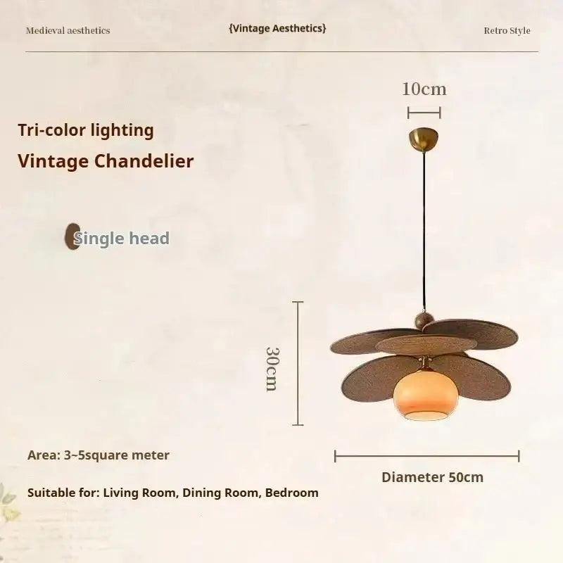 Vintage layered wood petal pendant light with dark bronze shades and amber glass globe for dining room brass accent
