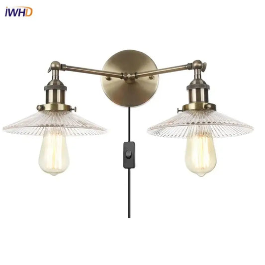 Vintage loft brass wall lamp with two clear ribbed glass shades and exposed edison bulbs decorbites industrial vintage design