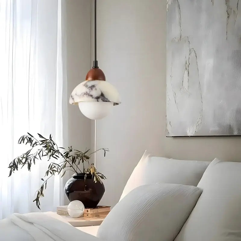 A vintage marbled glass ball led pendant light with white marble-patterned shade and bronze top for bedroom decorbites