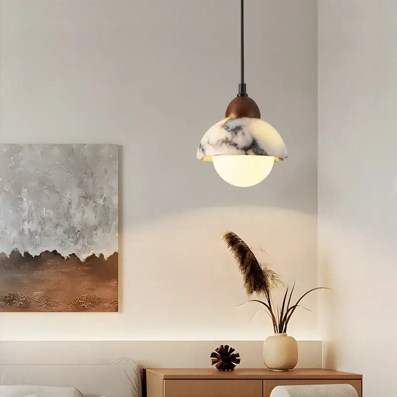 Vintage marbled glass ball led pendant light with warm glowing glass shade and dark bronze fixture for bedroom decorbites