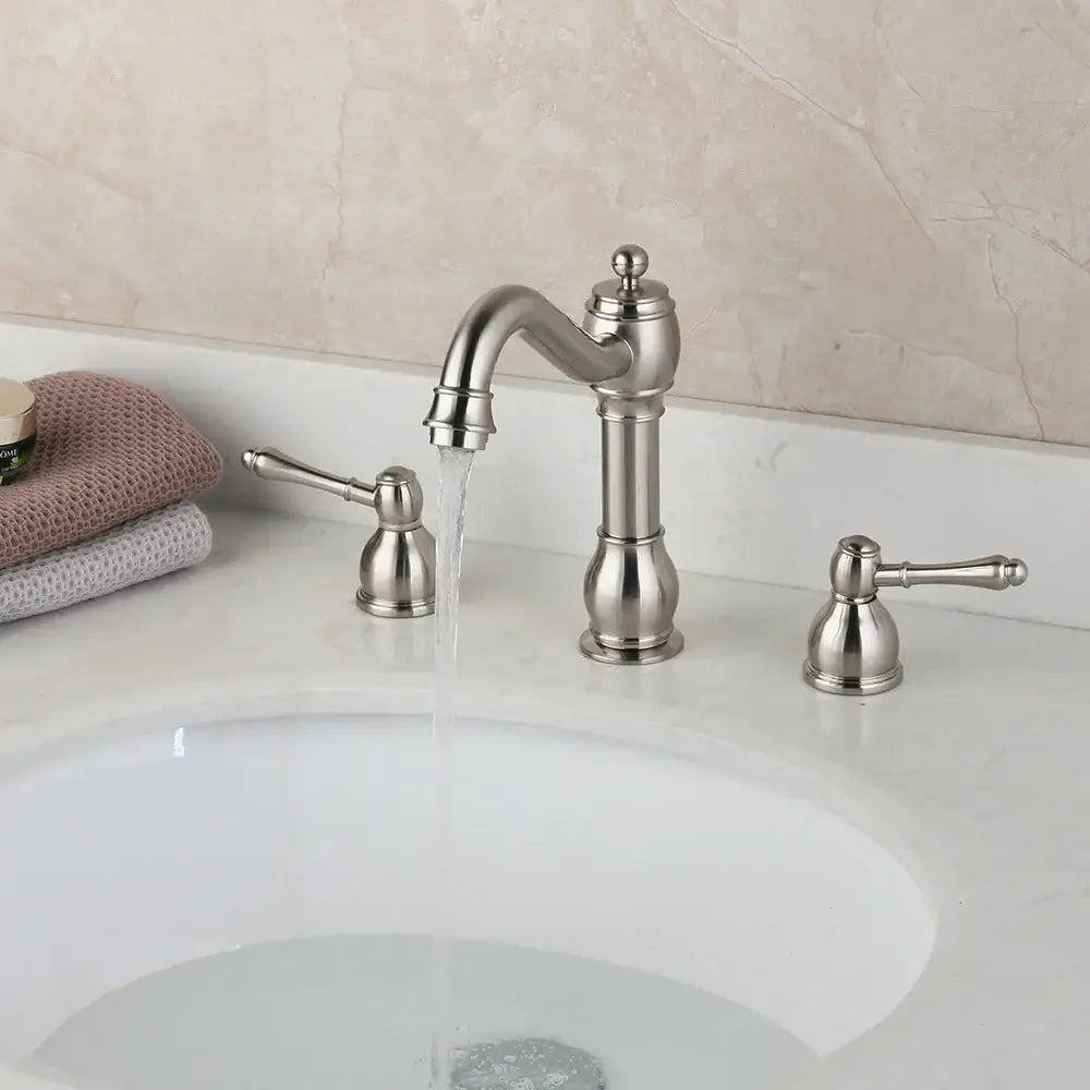 Brushed nickel decorbites dual handle bathroom faucet with elegant curved spout and ornate handles for sink use