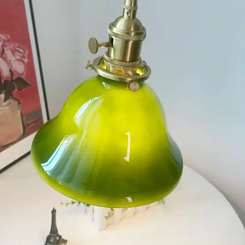 Vibrant lime green glass bell-shaped led pendant light with brass hardware for vintage kitchen lighting