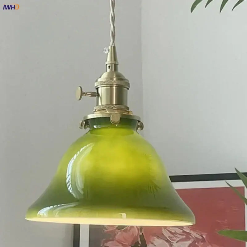 Vintage olive green glass led pendant lights with brass hardware featuring a translucent glass shade for kitchen use