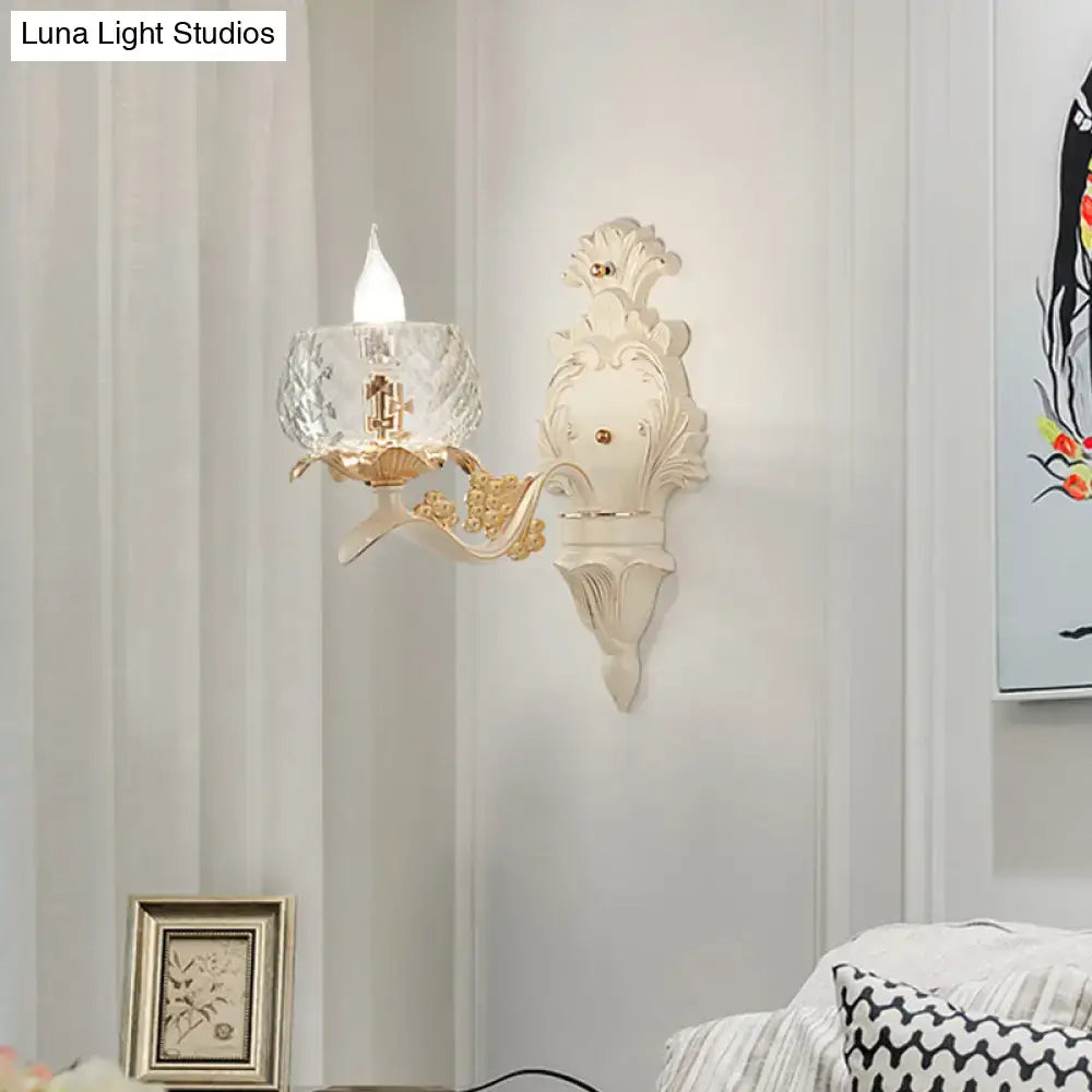 Elegant cream and gold vintage ornate wall light sconce with faceted crystal glass shade for bedroom use