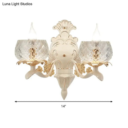 Elegant cream and gold vintage ornate wall light sconce with crystal glass shades for bedroom lighting