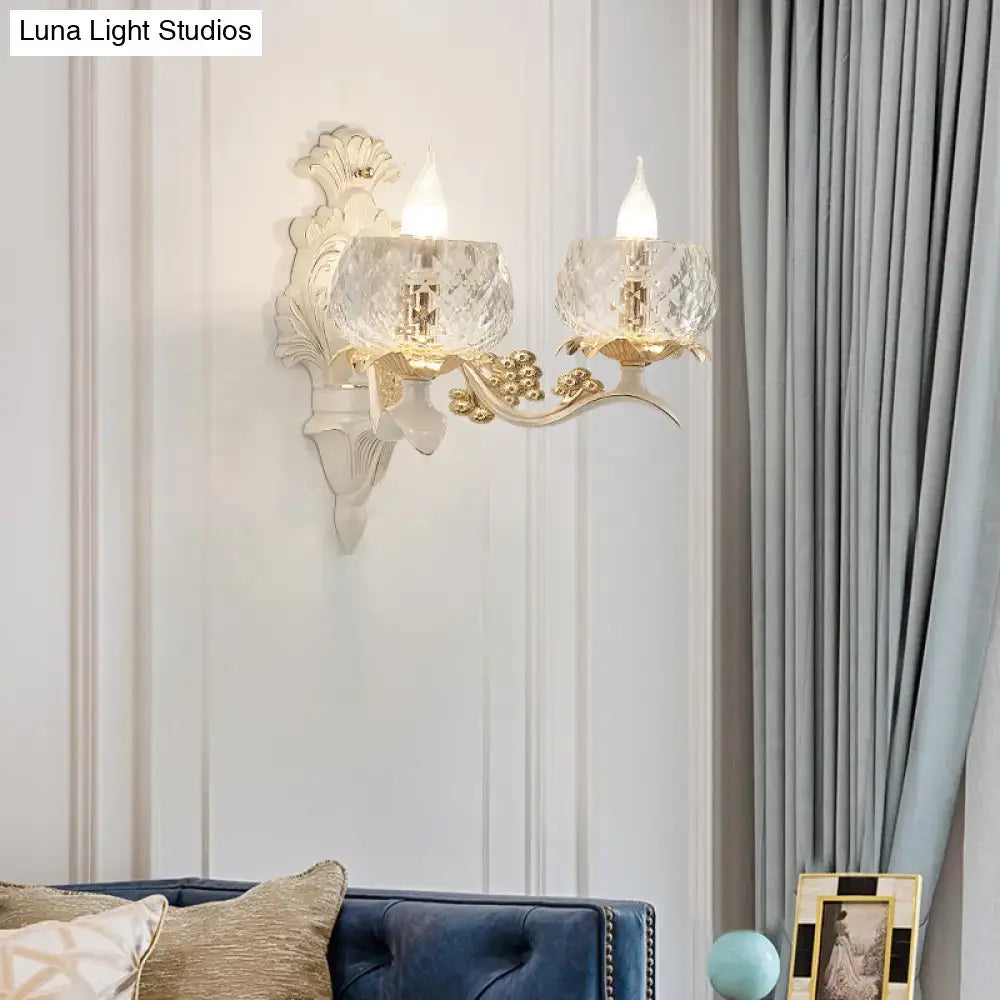 Elegant vintage ornate cream and gold wall light sconce with two faceted crystal glass shades and floral detailing