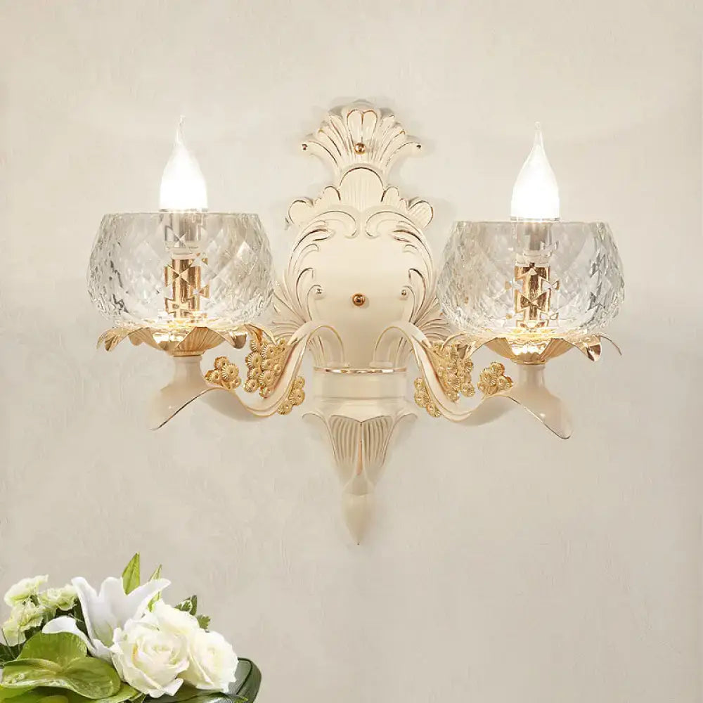 Elegant cream and gold vintage wall light sconce with two faceted crystal glass shades for bedroom use