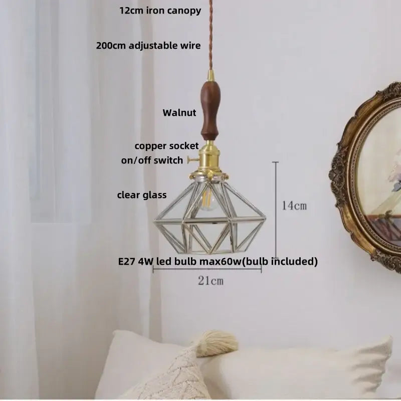 Diamond-shaped pendant light with clear glass cage brass accents and walnut handle featuring decorbites ceramic knob switch