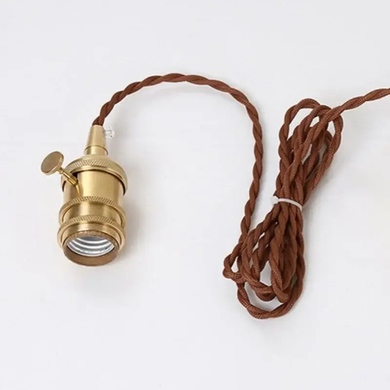 Vintage pale blue enamel pendant light with brass finish socket and twisted brown cord featuring decorbites ceramic knob switch